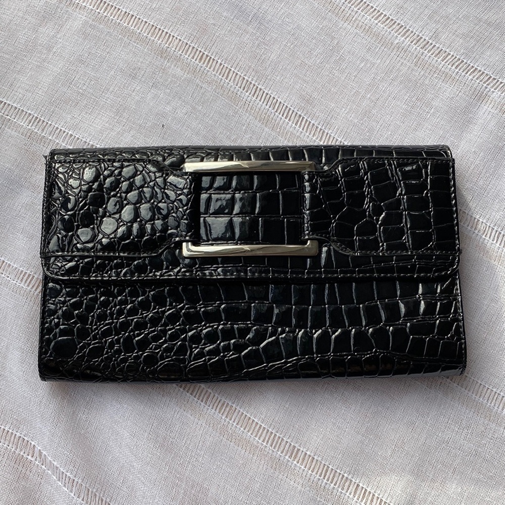 Candie’s animal print clutch with purple interior.